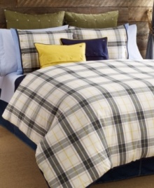Tommy Hilfiger's Lake George decorative pillow features a navy blue hue with yellow trim in cotton canvas. Embellished with decorative buttons and the Tommy Hilfiger monogram for a classic appeal. Tommy Hilfiger's Lake George decorative pillow features a navy blue hue with yellow trim in cotton canvas. Embellished with decorative buttons and the Tommy Hilfiger monogram for a classic appeal.