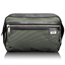 Neat and versatile, this full-featured travel kit has a casual look. Designed to sit on the counter or hang from a fixture, it features zip and open pockets inside and out, elastic loops to keep things organized and anti-bacterial lining. Neat and versatile, this full-featured travel kit has a casual look. Designed to sit on the counter or hang from a fixture, it features zip and open pockets inside and out, elastic loops to keep things organized and anti-bacterial lining.