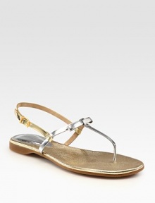 Skinny metallic leather straps in a two-tone design, enhanced by a rubber sole and adjustable slingback. Metallic leather upperLeather liningRubber solePadded insoleMade in Italy Skinny metallic leather straps in a two-tone design, enhanced by a rubber sole and adjustable slingback. Metallic leather upperLeather liningRubber solePadded insoleMade in Italy