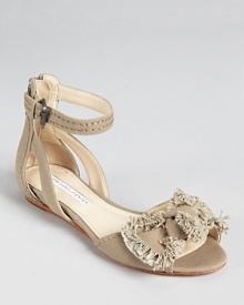 A frayed-edge bow lends low-key elegance on the Vera Wang Lavender Label Leni sandals, finished with a mini wedge for ever-so-slight height. A frayed-edge bow lends low-key elegance on the Vera Wang Lavender Label Leni sandals, finished with a mini wedge for ever-so-slight height.