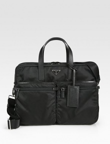 Double zip compartments and ample interior pockets enhances this classic nylon travel essential.Zip closureDouble top handlesAdjustable shoulder strapExterior, interior zip pockets13¾W x 12H x 11DMade in Italy Double zip compartments and ample interior pockets enhances this classic nylon travel essential.Zip closureDouble top handlesAdjustable shoulder strapExterior, interior zip pockets13¾W x 12H x 11DMade in Italy