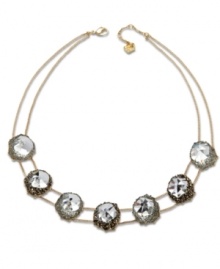 A natural inspiration. Swarovski's innovative gold tone mixed metal statement necklace features seven clear crystals in an exclusive cut. Each one is embellished with small crystals, creating breathtaking light reflections. Approximate length: 16-1/2 inches. A natural inspiration. Swarovski's innovative gold tone mixed metal statement necklace features seven clear crystals in an exclusive cut. Each one is embellished with small crystals, creating breathtaking light reflections. Approximate length: 16-1/2 inches.
