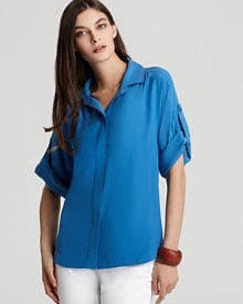 Lafayette 148 New York takes delicate silk and makes it bold with a boxy cut and splash of cobalt. Pair with red trousers for of-the-moment color blocking. Lafayette 148 New York takes delicate silk and makes it bold with a boxy cut and splash of cobalt. Pair with red trousers for of-the-moment color blocking.