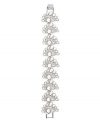 Remarkably refined. Embrace the elegance of this flex bracelet from Monet. Embellished with sparkling Swarovski crystals, as well as glass accents and simulated pearls, it's set in silver tone mixed metal. Approximate length: 7-1/2 inches.