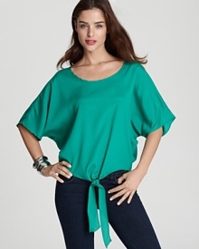 Richly hued and ultra-billowy, this Vintage Havana top boasts a tie at the hem for fresh summer style. Richly hued and ultra-billowy, this Vintage Havana top boasts a tie at the hem for fresh summer style.