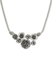 Pick some flowers this season. 2028's bib necklace features a bouquet of detailed floral pendants. Crafted in silver tone mixed metal. Approximate length: 16 inches + 3-inch extender. Approximate drop: 2-1/2 inches. Pick some flowers this season. 2028's bib necklace features a bouquet of detailed floral pendants. Crafted in silver tone mixed metal. Approximate length: 16 inches + 3-inch extender. Approximate drop: 2-1/2 inches.