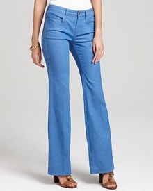 These stretch Tory Burch flared denim jeans channel the current '70s trend in a light wash with golden logo hardware for a modern, signature finish. These stretch Tory Burch flared denim jeans channel the current '70s trend in a light wash with golden logo hardware for a modern, signature finish.