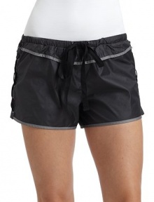 THE LOOKNarrow elastic waistband with drawstringContrast pipingLace-up sidesBack zip pocketTHE FITRise, about 9Inseam, about 1½THE MATERIALPolyester/nylonFully linedCARE & ORIGINHand washMade in USAModel shown is 5'10 (172½cm) wearing US size Small. THE LOOKNarrow elastic waistband with drawstringContrast pipingLace-up sidesBack zip pocketTHE FITRise, about 9Inseam, about 1½THE MATERIALPolyester/nylonFully linedCARE & ORIGINHand washMade in USAModel shown is 5'10 (172½cm) wearing US size Small.