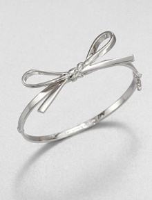 A sweet piece featuring a structured bow design. Rhodium-plated brassDiameter, about 2Hinged closureImported A sweet piece featuring a structured bow design. Rhodium-plated brassDiameter, about 2Hinged closureImported