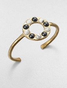From the Cabochon Collection. A slender yet bold cuff is dotted with a circle of cabochon stones, some with a gunmetal finish, some with natural veining, all adding impact to this sophisticated design.Natural stone18k goldplatedDiameter, about 2.25Made in USA From the Cabochon Collection. A slender yet bold cuff is dotted with a circle of cabochon stones, some with a gunmetal finish, some with natural veining, all adding impact to this sophisticated design.Natural stone18k goldplatedDiameter, about 2.25Made in USA
