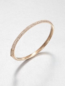 From the Brilliance Collection. Half of this graceful bangle is paved with sparkling rhinestones, the other half has a smooth, polished finish, with a handy hinge in between the two.GlassRose goldtoneDiameter, about 2.5Hinged with push-lock claspImported From the Brilliance Collection. Half of this graceful bangle is paved with sparkling rhinestones, the other half has a smooth, polished finish, with a handy hinge in between the two.GlassRose goldtoneDiameter, about 2.5Hinged with push-lock claspImported