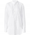 Luxurious white tuxedo shirt in a cotton-silk blend - With a Henley half placket - Tucks in the front - Slightly fitted - Nice and long to tuck into skirts or pants - A 24/7 classic that can be worn during the day with jeans or for evening with slim trousers - Styling tip: unbuttoned low and delicate gold jewellry. Wow!