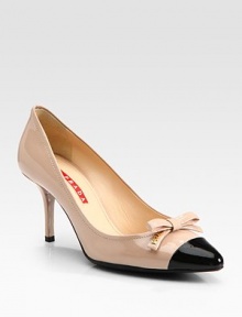 Bi-Color pointed toe design with bow detail. Self-covered heel, 3 (75mm)Patent leather upperLeather liningRubber solePadded insoleImportedOUR FIT MODEL RECOMMENDS ordering true size. 
