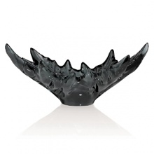 The sumptuous alleys of plane-trees that run alongside the « most beautiful Avenue of the World » have inspired the design of the finely veined crystal leaves on the Champs Elysees bowl. This emblematic piece designed in 1956 by Marc Lalique is transfigured by grey crystal. Through a magic alchemy, the light shining through the purity of the crystal creates ever changing reflections, making every piece unique. The sumptuous alleys of plane-trees that run alongside the « most beautiful Avenue of the World » have inspired the design of the finely veined crystal leaves on the Champs Elysees bowl. This emblematic piece designed in 1956 by Marc Lalique is transfigured by grey crystal. Through a magic alchemy, the light shining through the purity of the crystal creates ever changing reflections, making every piece unique.
