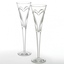 Enhance each toast you make at every special occasion. Where there is Love & Romance, there must be champagne! Whether celebrating your third date, 10th anniversary or millionth declaration of love, what better way to show it than with Waterford Crystal toasting flutes filled with champagne. These flutes were designed with a simple and elegant entwined double heart, representing the love and romance you share. Set of 2; 5 oz. Enhance each toast you make at every special occasion. Where there is Love & Romance, there must be champagne! Whether celebrating your third date, 10th anniversary or millionth declaration of love, what better way to show it than with Waterford Crystal toasting flutes filled with champagne. These flutes were designed with a simple and elegant entwined double heart, representing the love and romance you share. Set of 2; 5 oz.