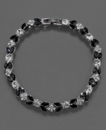 A versatile bracelet that adds a touch of pretty to every look, this Monet flex bracelet features jet stones and crystal accents set in silvertone mixed metal. Approximate length: 7-1/4 inches. A versatile bracelet that adds a touch of pretty to every look, this Monet flex bracelet features jet stones and crystal accents set in silvertone mixed metal. Approximate length: 7-1/4 inches.