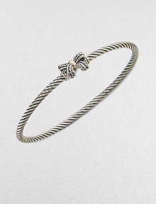 A charming, sterling silver cable design with a radiant 18k gold accented bow. Sterling silver18k goldDiameter, about 2½Slip-on styleImported 