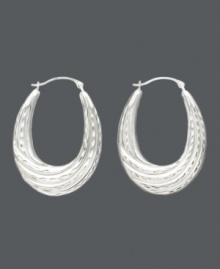 A lady can never go wrong with a classic pair of hoop earrings, especially when they have a twist. Made of 14k white gold, these hoops have an oval shape and feature a graduated twist hoop design. Approximate drop: 1-1/4 inches. Approximate width: 3/4 inch. A lady can never go wrong with a classic pair of hoop earrings, especially when they have a twist. Made of 14k white gold, these hoops have an oval shape and feature a graduated twist hoop design. Approximate drop: 1-1/4 inches. Approximate width: 3/4 inch.