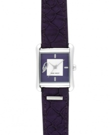 Exotic textures and bold color combine for the perfect everyday watch, by Nine West. Crafted of purple textured leather strap and square silver tone mixed metal case. Purple dial with white inner dial features silver tone applied stick indices, numeral at nine o'clock, silver tone hour and minute hands, sweeping second hand and logo at six o'clock. Quartz movement. Limited lifetime warranty. Exotic textures and bold color combine for the perfect everyday watch, by Nine West. Crafted of purple textured leather strap and square silver tone mixed metal case. Purple dial with white inner dial features silver tone applied stick indices, numeral at nine o'clock, silver tone hour and minute hands, sweeping second hand and logo at six o'clock. Quartz movement. Limited lifetime warranty.