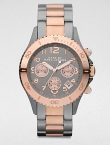 A technical timepiece in a chic two-tone stainless steel. Quartz movementWater resistant to 5 ATMRound gunmetal-finished stainless steel case, 40mm (1.6)Decorative engraved rose goldtone ion-plated bezelGunmetal chronograph dialNumeric hour markersDate display between 4 and 5 o'clockSecond hand Two-tone stainless steel link braceletImported A technical timepiece in a chic two-tone stainless steel. Quartz movementWater resistant to 5 ATMRound gunmetal-finished stainless steel case, 40mm (1.6)Decorative engraved rose goldtone ion-plated bezelGunmetal chronograph dialNumeric hour markersDate display between 4 and 5 o'clockSecond hand Two-tone stainless steel link braceletImported