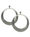 GUESS takes the traditional hoop earring and adds an on-trend twist with a unique textured design. Set in imitation rhodium-plated mixed metal. Approximate drop: 3-1/2 inches. Approximate diameter: 2-1/4 inches.