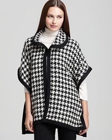 Classic houndstooth gets a contemporary twist with the loose silhouette of this Live a Little cape. Wear with essential black pants and understated boots. Classic houndstooth gets a contemporary twist with the loose silhouette of this Live a Little cape. Wear with essential black pants and understated boots.
