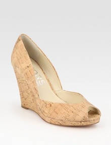 Low-cut peep toe in wonderfully textured cork, grounded by a substantial wedge. Cork wedge, 3½ (90mm)Cork upperLeather lining and solePadded insoleImported