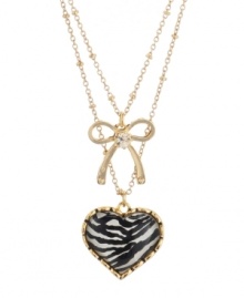 Earn your stripes. A chic zebra pattern defines this dramatic double-row necklace from Betsey Johnson. Featuring heart and bow emblems along with sparkling crystal accents, it's crafted in gold tone mixed metal. Item comes packaged in a signature gift box. Approximate length: 16 inches + 3-inch extender. Approximate drop: 1 inch (heart), 3/4 inch (bow). Earn your stripes. A chic zebra pattern defines this dramatic double-row necklace from Betsey Johnson. Featuring heart and bow emblems along with sparkling crystal accents, it's crafted in gold tone mixed metal. Item comes packaged in a signature gift box. Approximate length: 16 inches + 3-inch extender. Approximate drop: 1 inch (heart), 3/4 inch (bow).