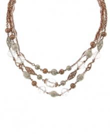 Add stylish dimension to any ensemble with three, chic layers. 2028 necklace features silver, rose gold tone mixed metal chains and filigree beads mixed with sparkling clear crystals. Approximate length: 16 inches + 3-inch extender.