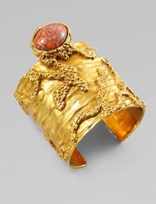 Like a piece of modern sculpture you'd find in a museum, this wide golden cuff combines the intriguing textures of tree bark and rough stone, capped by an oval glass cabochon with a mottled semiprecious look.GlassGoldtoneDiameter, about 2¼Made in Italy Like a piece of modern sculpture you'd find in a museum, this wide golden cuff combines the intriguing textures of tree bark and rough stone, capped by an oval glass cabochon with a mottled semiprecious look.GlassGoldtoneDiameter, about 2¼Made in Italy