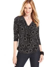 Add a fun pop of print to any ensemble with Fever's twist-front top. Add a fun pop of print to any ensemble with Fever's twist-front top.