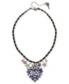 A heartfelt statement. Betsey Johnson's necklace is crafted from hematite-plated silver-tone mixed metal with black grosgrain ribbon. Glass pearls and crystal accents provide a vibrant touch. Approximate length: 16 inches + 3-inch extender. Approximate drop: 2 inches.