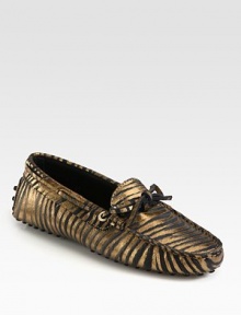 Moccasin-inspired silhouette of metallic leather takes on an exotic zebra print for a fashionable look. Zebra-print metallic leather upperLeather liningRubber solePadded insoleMade in Italy Moccasin-inspired silhouette of metallic leather takes on an exotic zebra print for a fashionable look. Zebra-print metallic leather upperLeather liningRubber solePadded insoleMade in Italy