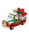 Santa treks in from the North Pole in his pickup, the only way to get oversize gifts under the tree! Handcrafted in pure glass with elaborate hand-painted detail, like a Radko license plate, sparkly gold rims and candy-stripe gift wrap.