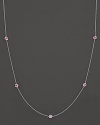 Sapphire stations with Roberto Coin's signature ruby accents add a touch of drama to this gorgeous gold necklace.