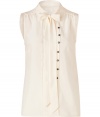 Detailed with a button and looped front panel (which lets you decide how tailored you want to wear it), Marc by Marc Jacobs sleeveless silk top is a unique feminine staple with endless wearing possibilities - Stand-up collar with tie, V-neckline, sleeveless, gathered yolk, front panel with button and loop detail, pull-over style - Loosely fitted - Wear with a boyfriend blazer, dark-wash skinnies and heels