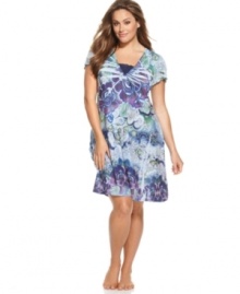 A 60's inspired print adds a fun feel to this carefree chemise from One World. Delicate eyelet detail adds the perfect amount of polish to this easy-going style. A 60's inspired print adds a fun feel to this carefree chemise from One World. Delicate eyelet detail adds the perfect amount of polish to this easy-going style.