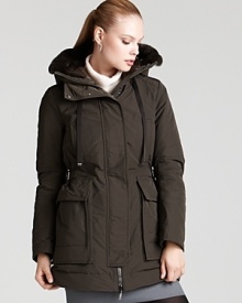 Adjustable side buckles lend a cinched waist silhouette to this ultra-warm Moncler anorak. A sumptuous fur-trimmed hood stops winter chills with luxe style. Adjustable side buckles lend a cinched waist silhouette to this ultra-warm Moncler anorak. A sumptuous fur-trimmed hood stops winter chills with luxe style.