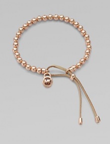 A smooth, beaded design with a logo lock charm and an adjustable leather closure. Rose goldtone metalDiameter, about 2.5Slip-on style with adjustable leather closureImported A smooth, beaded design with a logo lock charm and an adjustable leather closure. Rose goldtone metalDiameter, about 2.5Slip-on style with adjustable leather closureImported