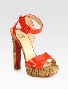 Sky-high heel and platform in an abstract print, finished with vibrant patent leather straps and a signature red leather sole. Self-covered heel, 5½ (140mm)Covered platform, 1 (25mm)Compares to a 4½ heel (115mm)Patent leather upperLeather liningSignature red leather solePadded insoleMade in Italy