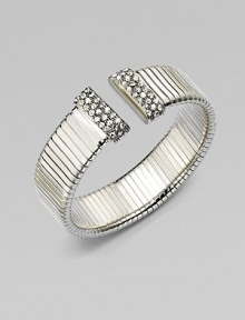 An elegantly ribbed, flexible cuff with Swarovski crystal caps.CrystalSilverplatedDiameter, about 2¼Made in Italy An elegantly ribbed, flexible cuff with Swarovski crystal caps.CrystalSilverplatedDiameter, about 2¼Made in Italy