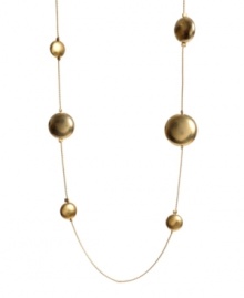 Add a long layer of rich, golden bubbles to your neckline in this light and airy necklace. Crafted in worn gold tone mixed metal; by Kenneth Cole New York. Approximate length: 36 inches. Add a long layer of rich, golden bubbles to your neckline in this light and airy necklace. Crafted in worn gold tone mixed metal; by Kenneth Cole New York. Approximate length: 36 inches.