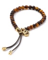 Round out your jewelry box with this bracelet from MICHAEL Michael Kors. This pieces' tortoise shell beads boldly nod to classic style while the hardware is wholly modern.