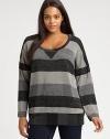 A glamorous take on an athletic style, this striped top is enhanced by pretty metallic thread. Its relaxed-yet-feminine silhouette will complement your shape.Round neckLong sleevesPull-on styleAbout 26 from shoulder to hemRayon/lurexMachine washMade in USA