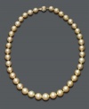 Bring warmth and energy to your look with this sunshine-colored strand. Golden South Sea pearls (10-12-1/2 mm) form a rich, graduated circle around your neck. 14k gold clasp. Approximate length: 18 inches.