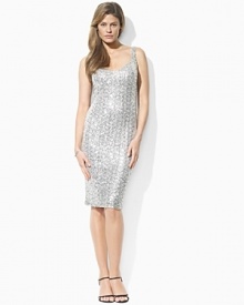 An elegant sleeveless dress channels vintage Hollywood glamour with a shimmering sequined mesh overlay and a flattering sweetheart neckline. An elegant sleeveless dress channels vintage Hollywood glamour with a shimmering sequined mesh overlay and a flattering sweetheart neckline.