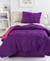 Anything but ordinary, this Marrakesh Market comforter set offers a distinct Moroccan feel with expert ruched texture and metallic stitched details for luxe glimmer. A rich purple hue finishes this trendy look. Reverses to solid pink.