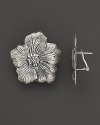 Delicate gardenias, captured at the height of their beauty in sterling silver, bloom on these earrings from Buccellati.