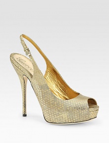 Open-toe platform design in lustrous metallic python with an adjustable slingback strap. Self-covered heel, 5½ (140mm)Covered platform, 1 (25mm)Compares to a 4½ heel (115mm)Metallic python upperLeather liningBuffed leather solePadded insoleMade in ItalyOUR FIT MODEL RECOMMENDS Ordering true to size Open-toe platform design in lustrous metallic python with an adjustable slingback strap. Self-covered heel, 5½ (140mm)Covered platform, 1 (25mm)Compares to a 4½ heel (115mm)Metallic python upperLeather liningBuffed leather solePadded insoleMade in ItalyOUR FIT MODEL RECOMMENDS Ordering true to size