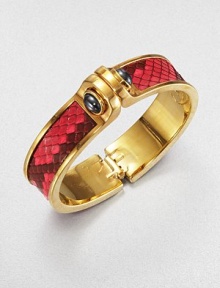 Edgy and exotic, this design is centered with a strip of vivid pink python, the bold polished cuff linked with domes of hematite.HematitePythonGoldplated brassDiameter, about 2.5Width, about 1Hinged and claspedMade in USA Edgy and exotic, this design is centered with a strip of vivid pink python, the bold polished cuff linked with domes of hematite.HematitePythonGoldplated brassDiameter, about 2.5Width, about 1Hinged and claspedMade in USA
